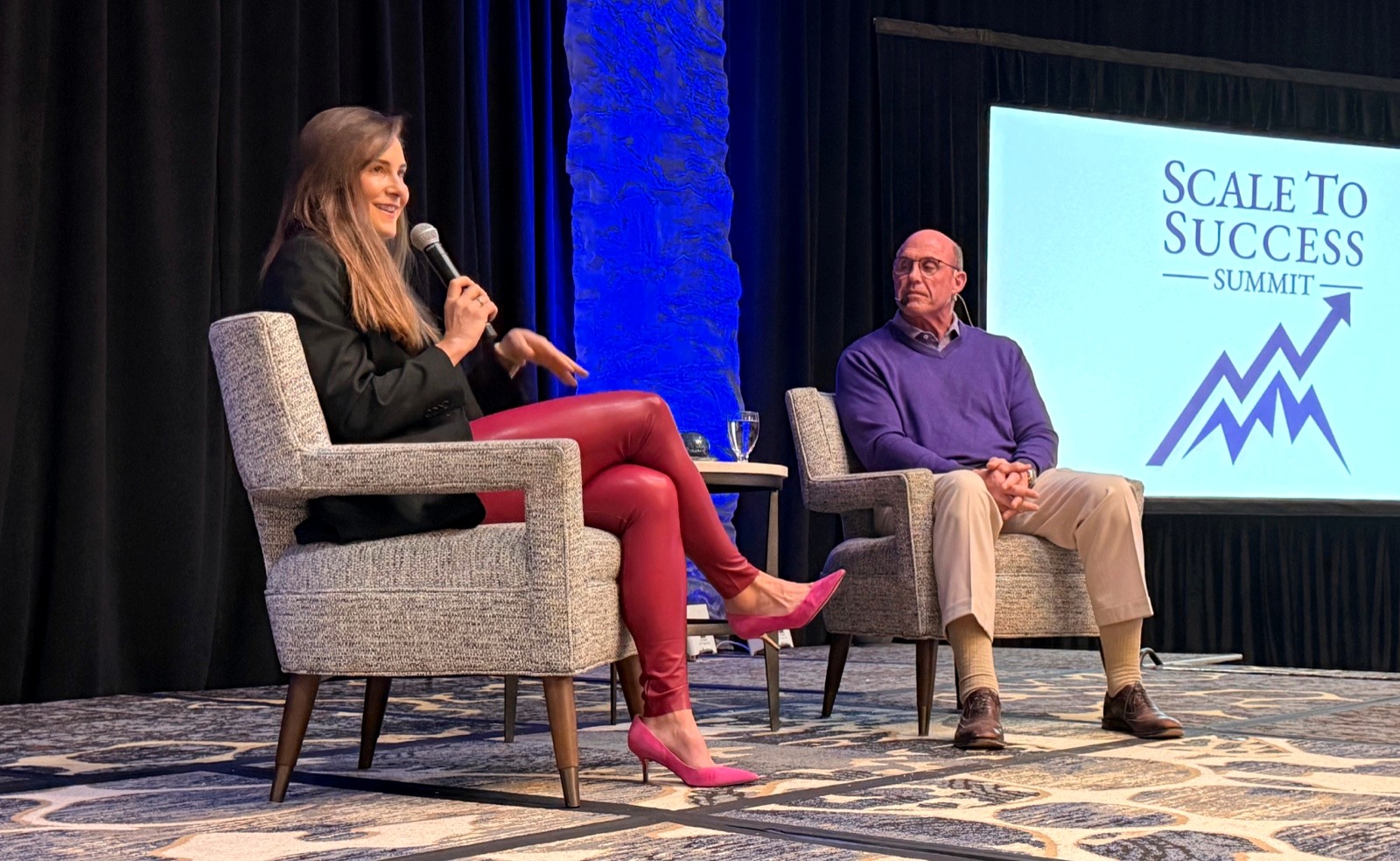 Willa Kammerer speaking on stage at the Scale to Success Summit